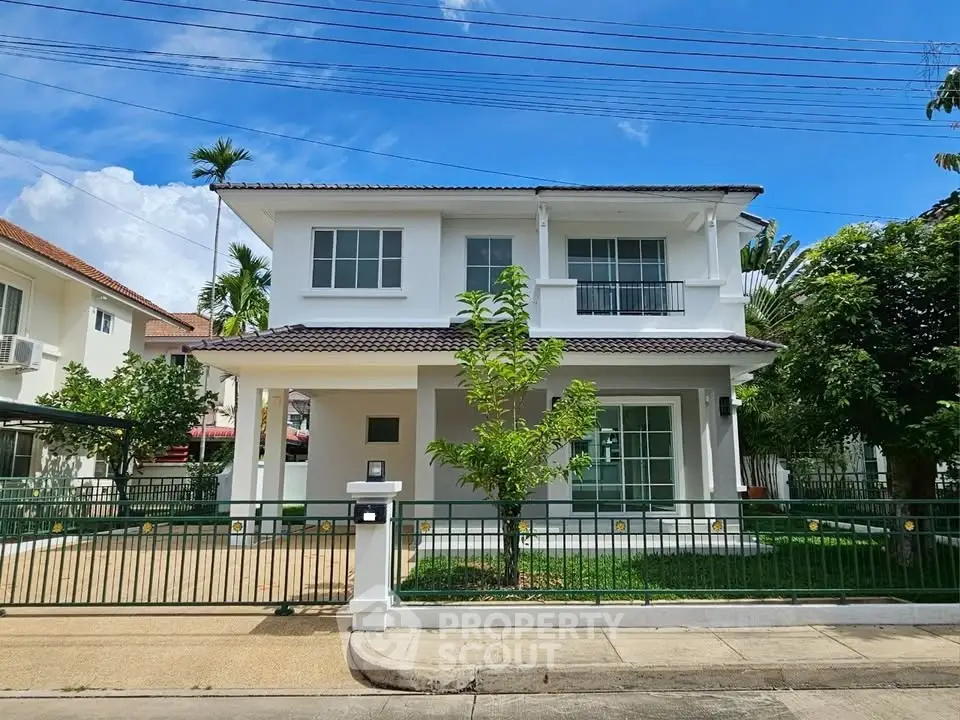 Charming two-story house with lush garden and modern design in a serene neighborhood.