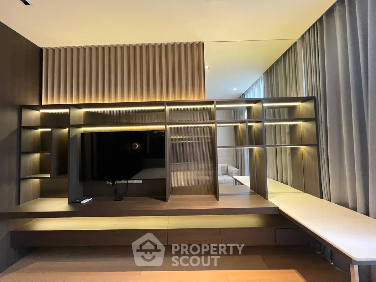 Luxurious modern living room with built-in shelving and ambient lighting