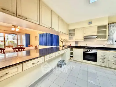 Spacious kitchen with modern appliances and ample storage in a bright, open layout.