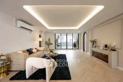 Luxurious living room with modern decor and spacious balcony view