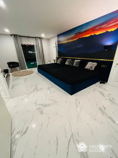 Spacious living room with high-gloss marble flooring and a large, plush blue sofa set against an impressive sunset wall mural, offering a luxurious and inviting atmosphere.