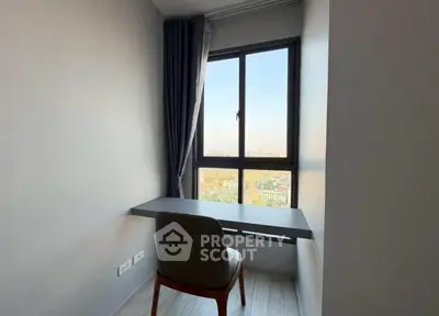 Cozy study nook with a stunning city view, perfect for work-from-home setup.