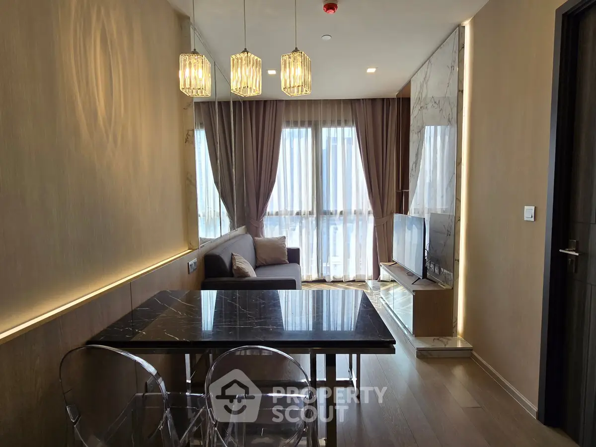 Modern living room with elegant lighting and stylish furniture in a cozy apartment.