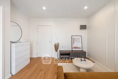 Modern living room with minimalist decor and wooden flooring