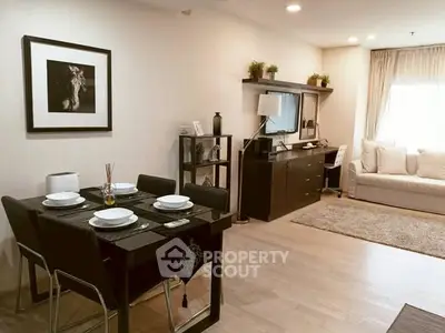 Stylish living room with modern decor and dining area, perfect for cozy gatherings.