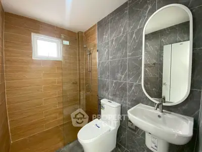 Modern bathroom with sleek design and glass shower enclosure