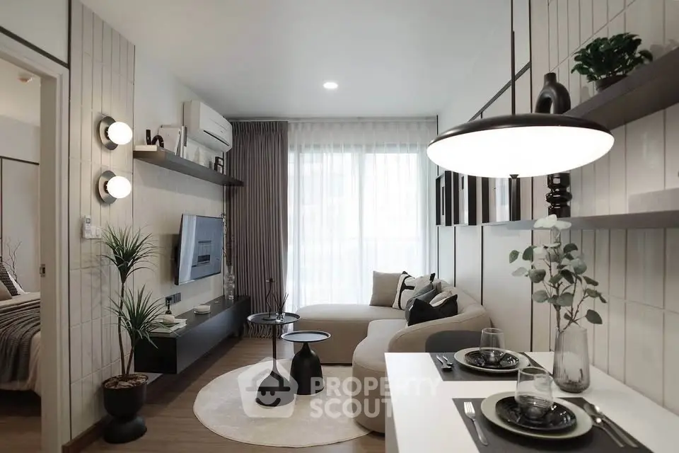 Modern living room with stylish decor and natural light, featuring a cozy sofa and elegant dining area.