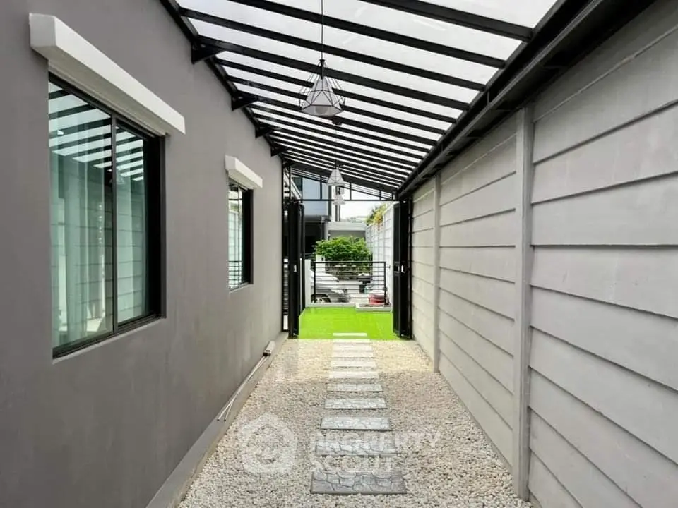 Modern exterior walkway with sleek design and garden view