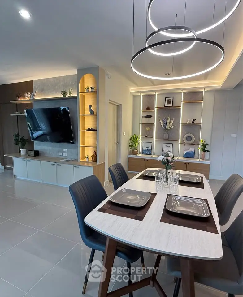 Modern dining area with elegant lighting and stylish decor in a contemporary home interior.