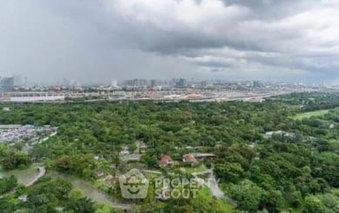 Stunning panoramic cityscape view with lush greenery and skyline