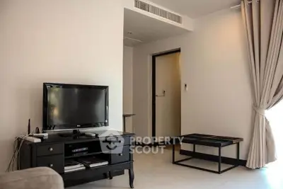 Modern living room with TV and elegant furniture in a cozy apartment