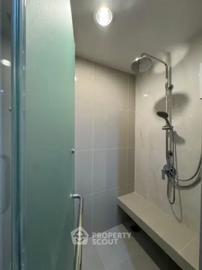 Modern bathroom with sleek shower design and glass door