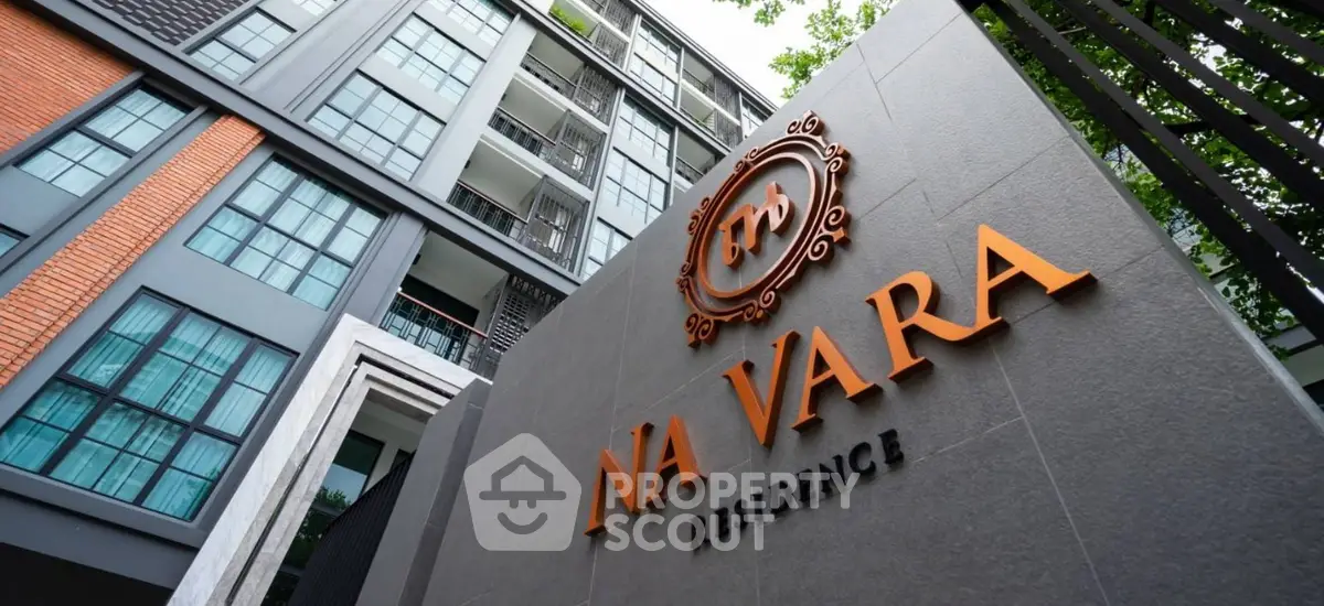 Modern residential building exterior with stylish facade and lush greenery at Na Vara Residence.