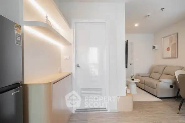 Modern living room with sleek design and cozy seating area