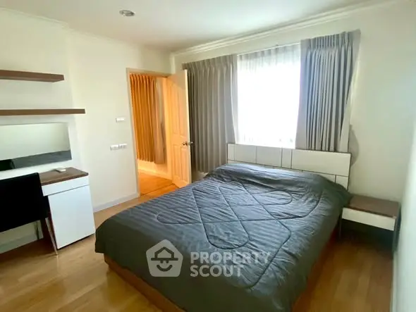 Cozy bedroom with modern furnishings and natural light