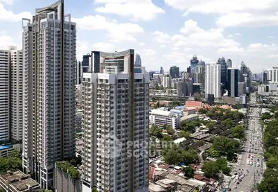 Stunning high-rise buildings with cityscape view, perfect urban living in prime location.