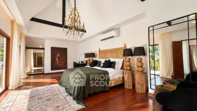 Luxurious bedroom with elegant chandelier and hardwood floors in a spacious villa.