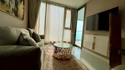 Modern living room with stylish decor and large window for natural light.