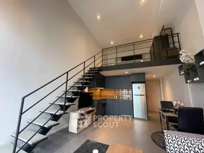 Modern loft apartment with sleek kitchen and stylish mezzanine level