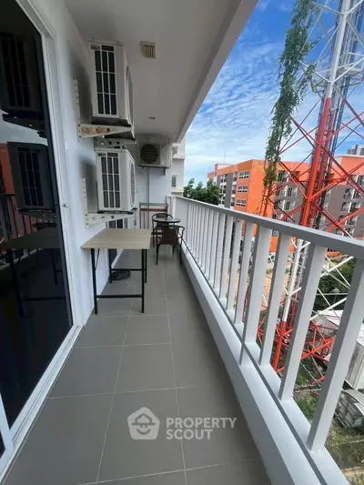 Spacious balcony with modern air conditioning units and scenic view