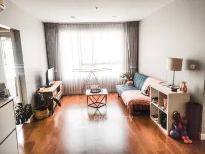 Spacious living room with cozy decor and natural light