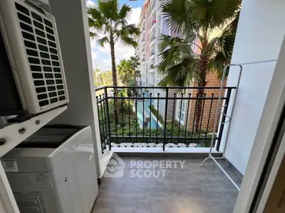 Charming balcony with garden view in modern apartment complex