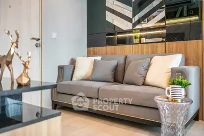 Modern living room with stylish decor and comfortable gray sofa