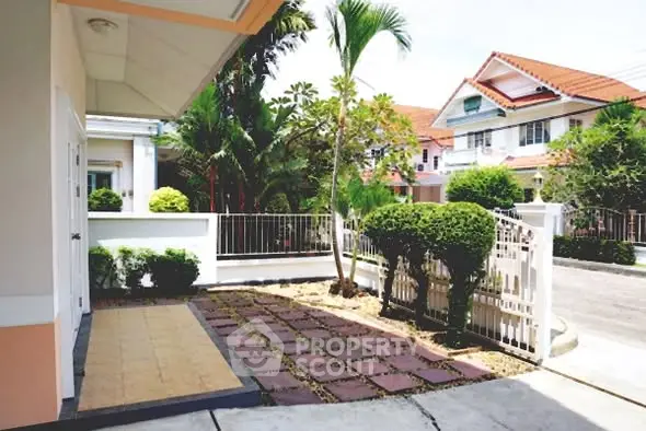 Charming suburban home with lush garden and inviting entrance