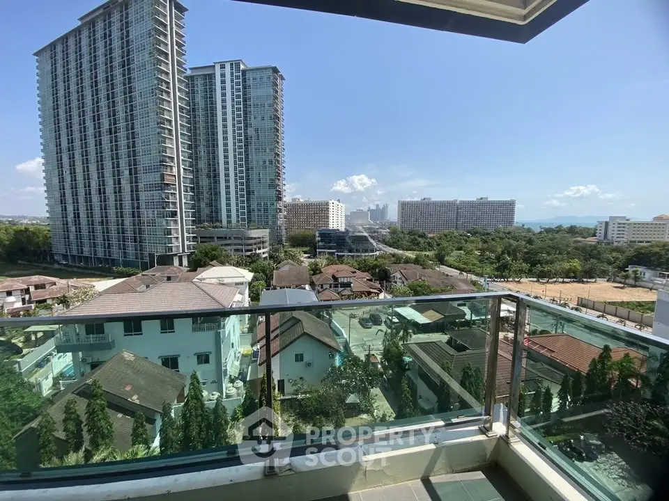 Stunning high-rise balcony view with cityscape and ocean horizon