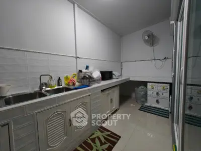 Spacious kitchen with modern appliances and ample counter space