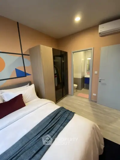 Modern bedroom with ensuite bathroom and stylish decor