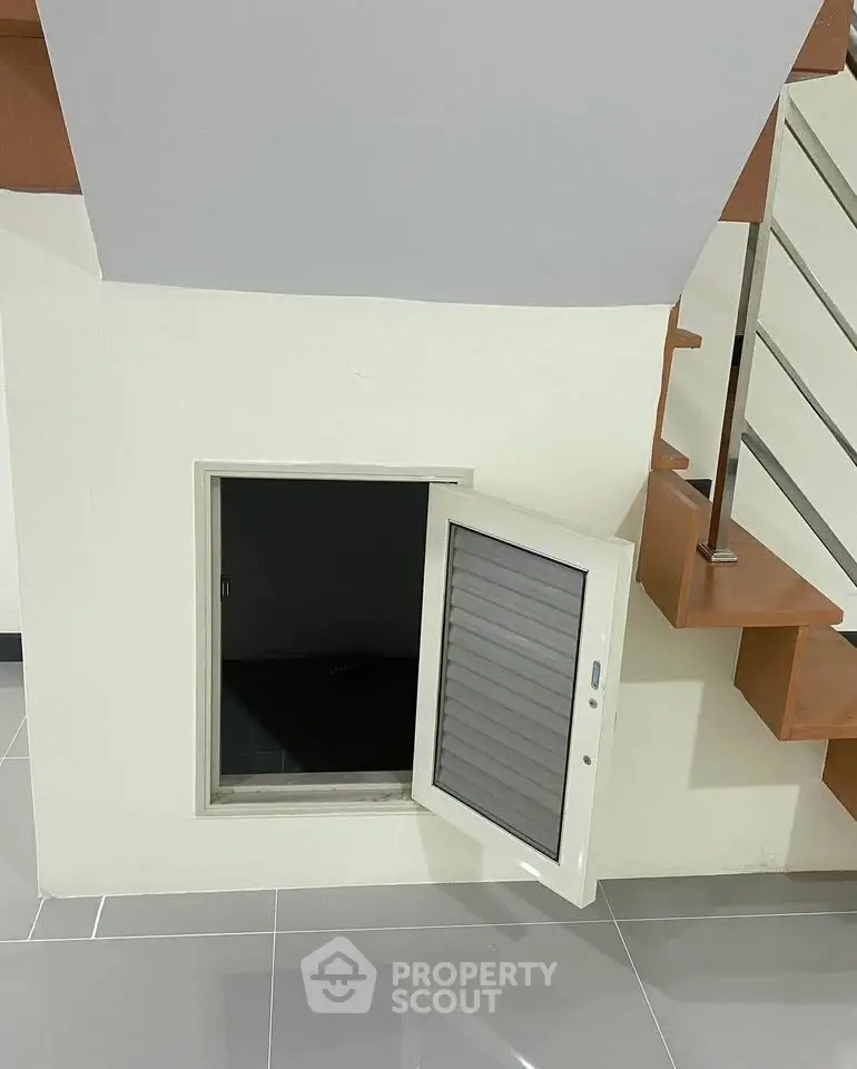 Unique storage space under staircase with modern design