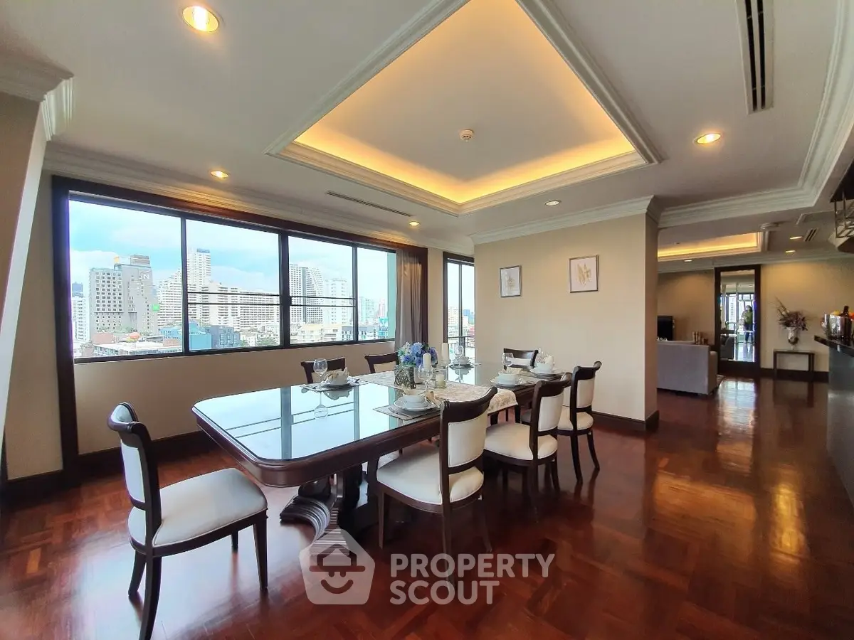 Luxurious dining area with stunning city view and elegant wooden flooring.