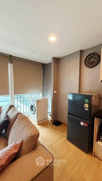 Cozy living room with modern appliances and natural light