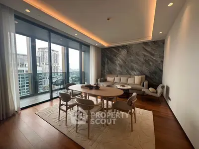 Luxurious living room with modern decor and stunning city view from large balcony.