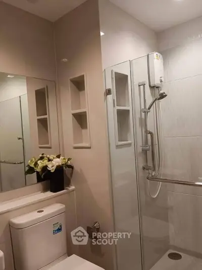 Modern bathroom with sleek shower and elegant fixtures