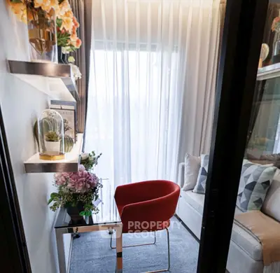 Cozy study nook with modern red chair and elegant decor, perfect for productivity and relaxation.