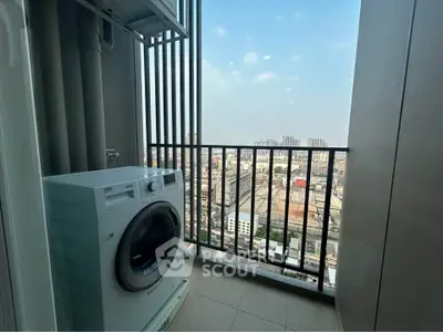 High-rise apartment balcony with washing machine and stunning city view