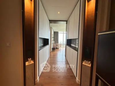 Luxurious hallway leading to a spacious living area with a stunning view