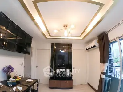 Modern living room with elegant ceiling design and dining area, featuring stylish decor and ample natural light.