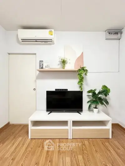Modern living room with sleek TV stand and air conditioning