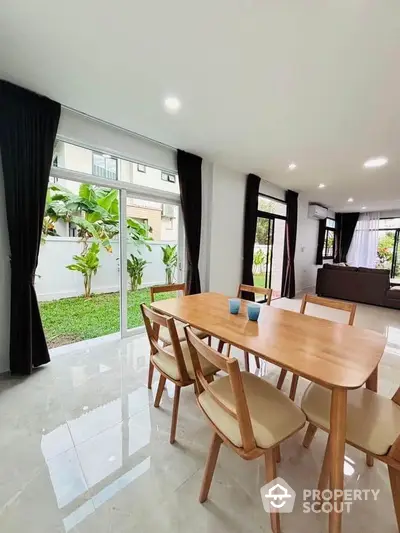 Spacious dining area with garden view in modern home