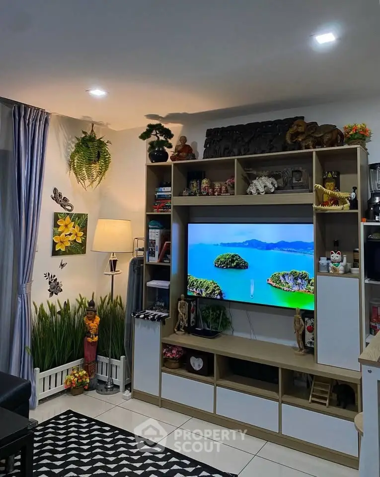 Cozy living room with modern entertainment center and vibrant decor