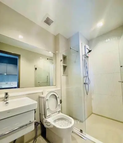 Modern bathroom with glass shower and sleek fixtures