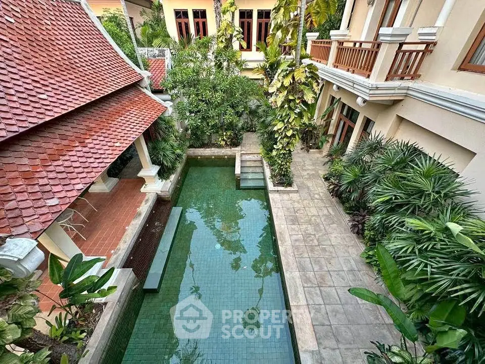 Stunning courtyard with pool and lush greenery in luxurious property