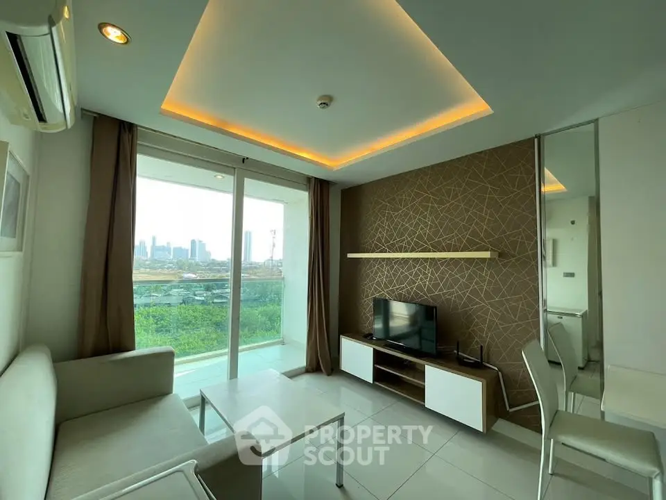 Modern living room with city view, sleek furniture, and ambient lighting in a high-rise apartment.