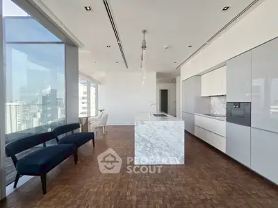 Luxurious modern kitchen with marble island and panoramic city views