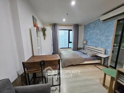 Modern studio apartment with stylish decor and city view