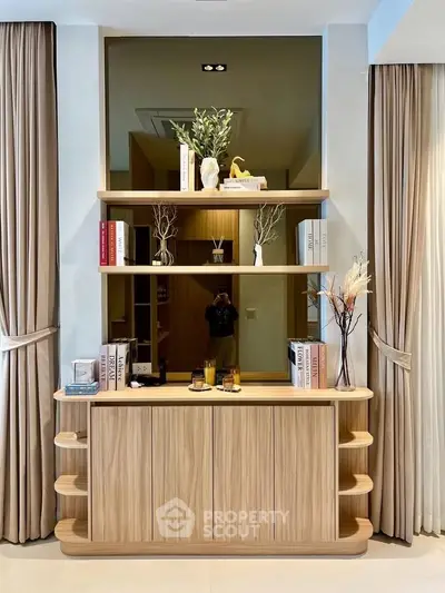 Elegant living room with stylish wooden shelves and decorative elements, perfect for modern interiors.