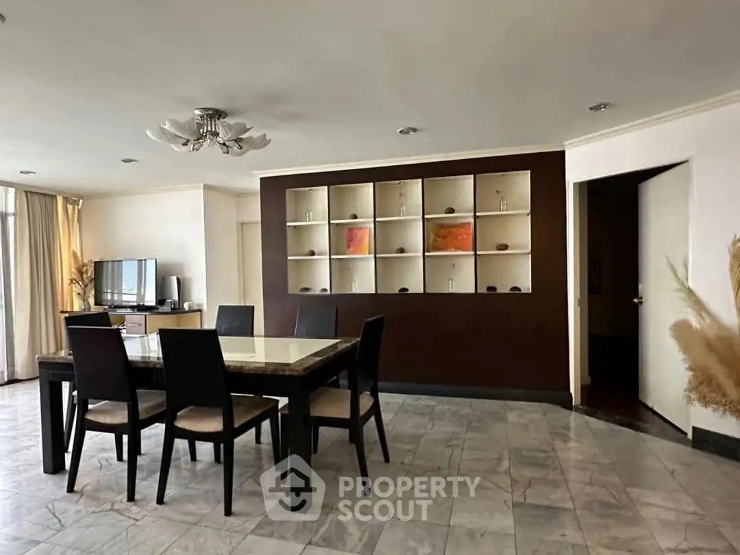Spacious dining area with elegant marble flooring and modern decor